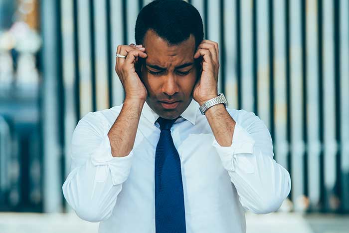 Hispanic man with headache